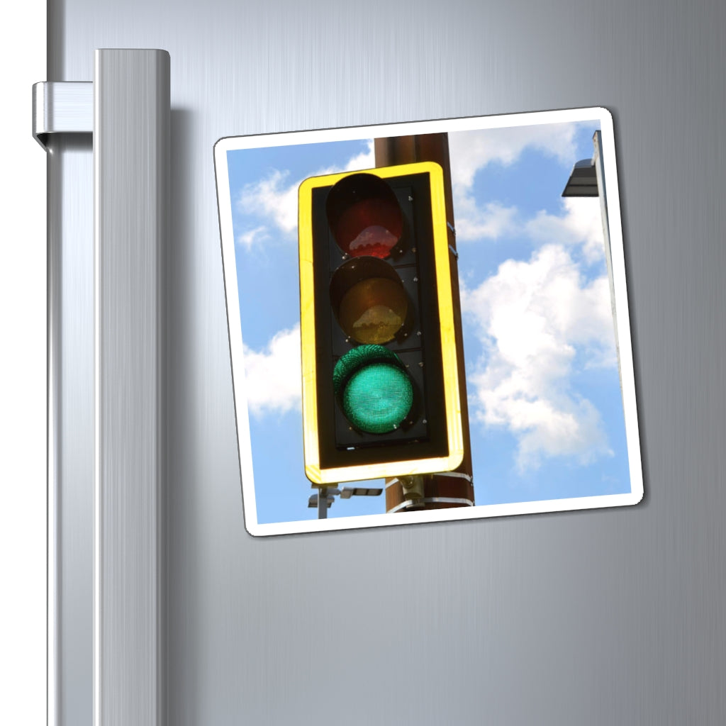 A set of vibrant green light magnets showcasing various sizes and a black backing, ideal for displaying messages on metallic surfaces.