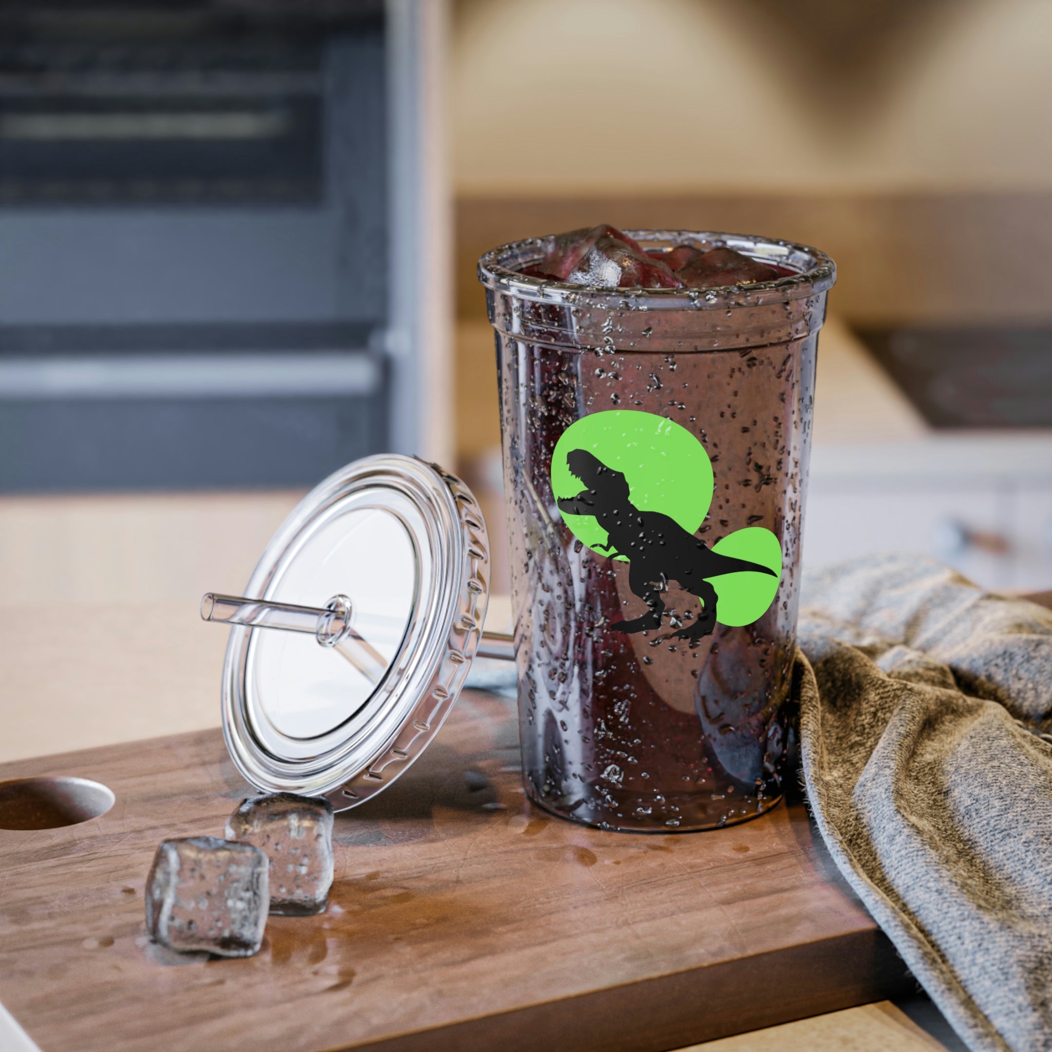 A vibrant green acrylic cup featuring a Tyrannosaurus Rex design, complete with a plastic lid and straw, showcasing its double-wall insulation.