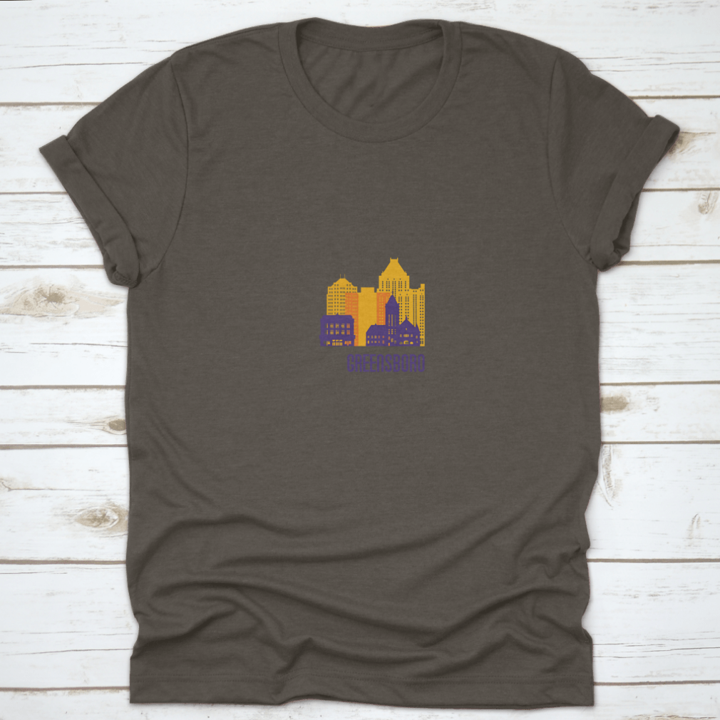 Colorful Greensboro City Emblem T-shirt featuring vibrant buildings, made from 100% cotton.