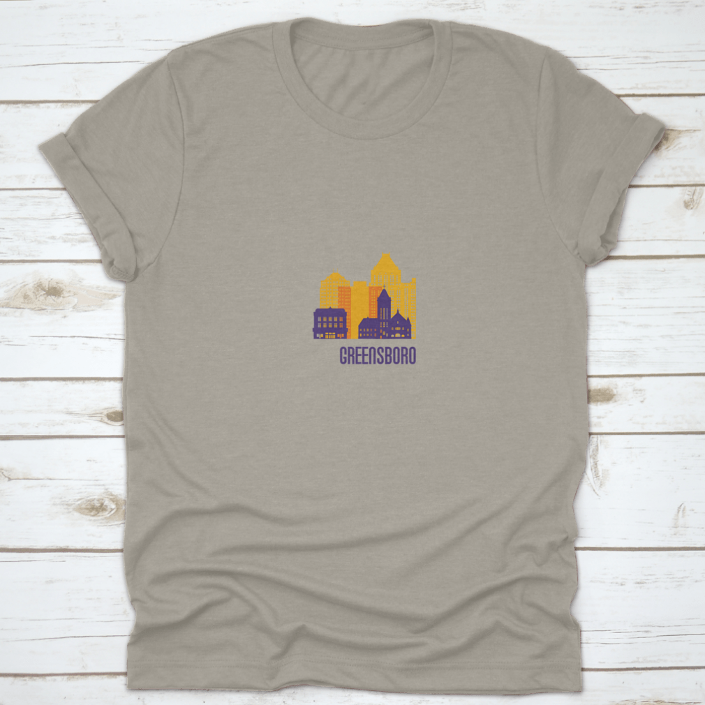 Colorful Greensboro City Emblem T-shirt featuring vibrant buildings, made from 100% cotton.