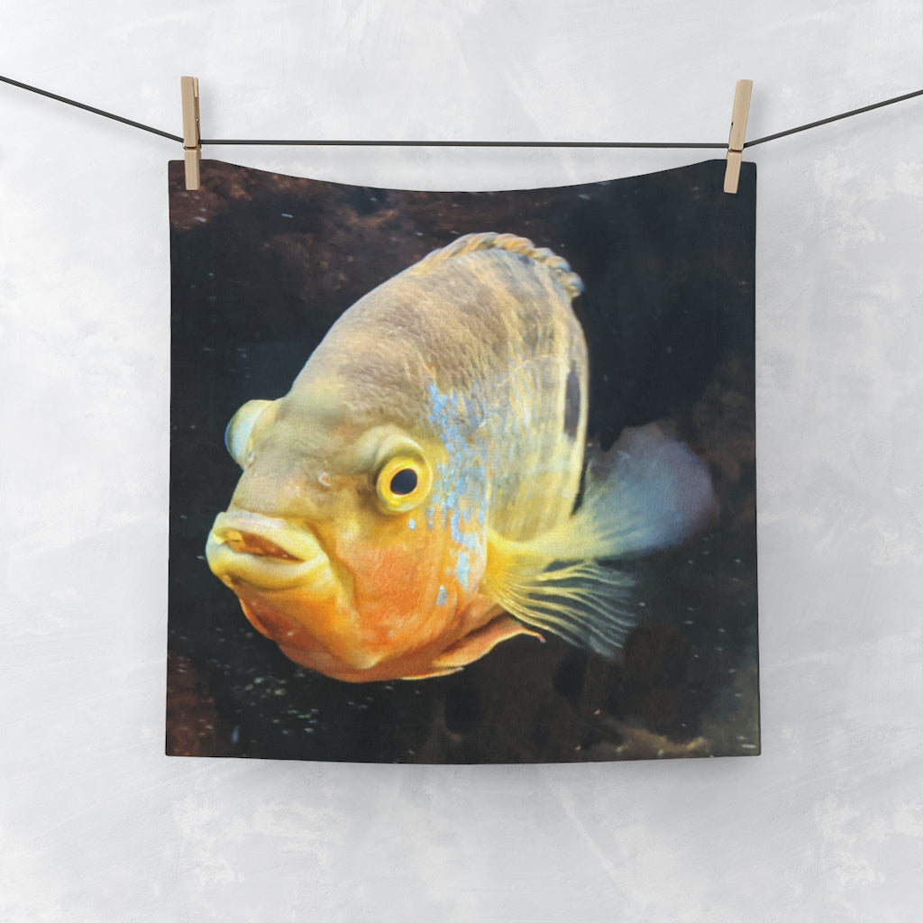 Grey and orange face towel featuring a fish design, made from a polyester blend front and soft cotton back.