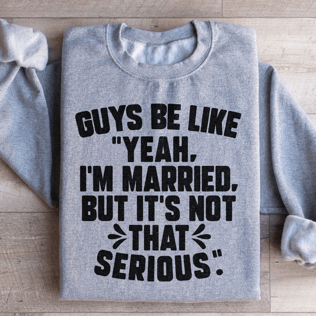 A cozy sweatshirt featuring the phrase 'Guys Be Like Yeah I'm Married', designed by top artists, showcasing a stylish and humorous design.