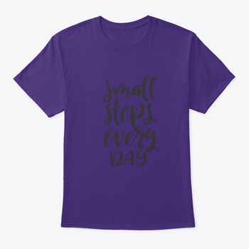 A stylish t-shirt featuring hand-drawn brush pen lettering with the phrase 'Small Steps Every', showcasing its comfortable fit and quality fabric.