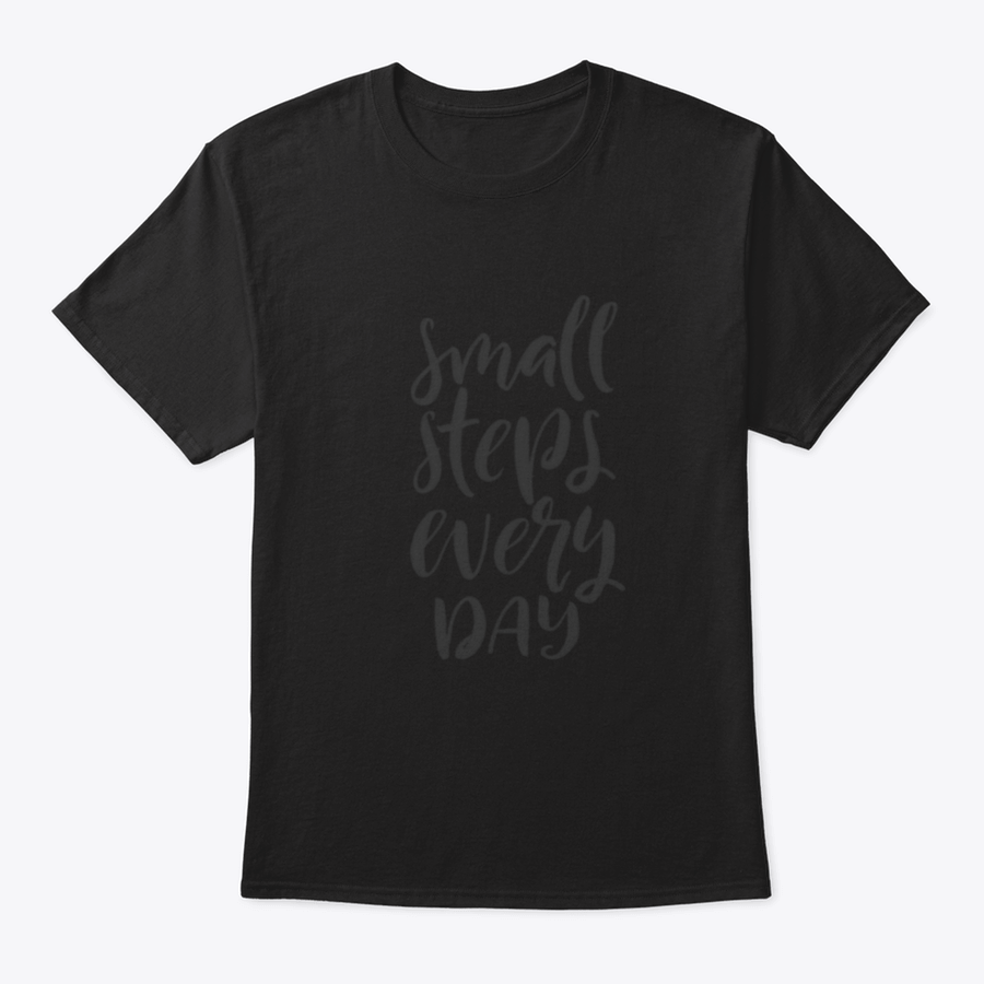 A stylish t-shirt featuring hand-drawn brush pen lettering with the phrase 'Small Steps Every', showcasing its comfortable fit and quality fabric.
