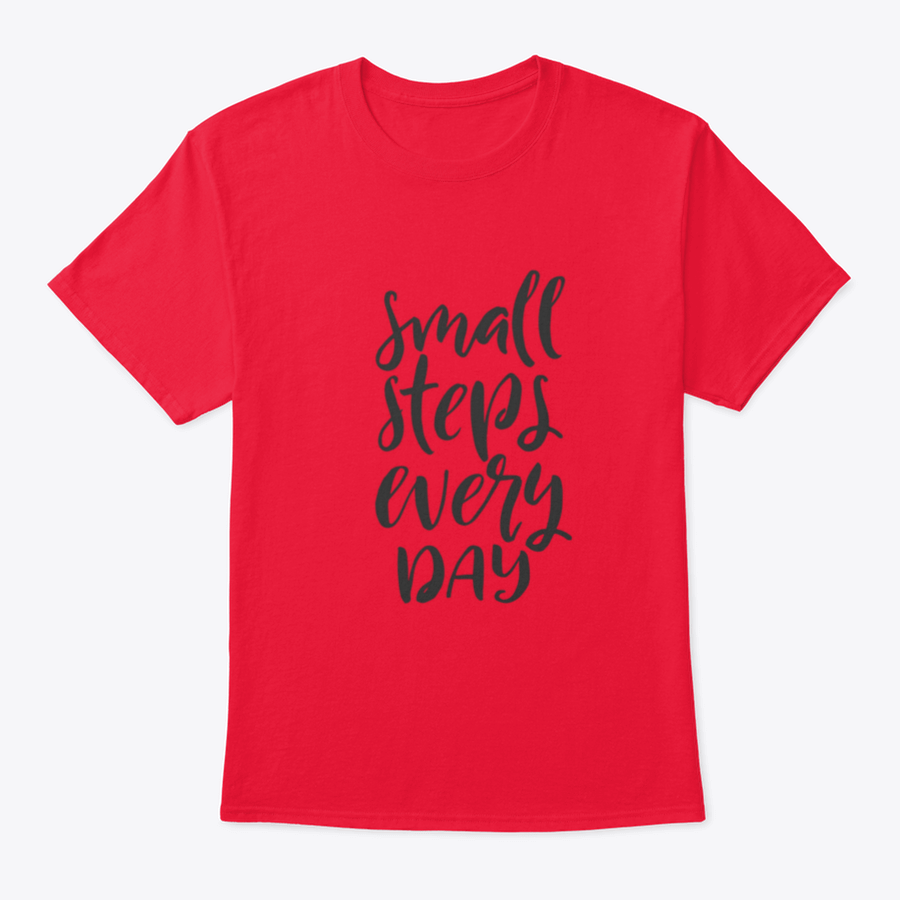 A stylish t-shirt featuring hand-drawn brush pen lettering with the phrase 'Small Steps Every', showcasing its comfortable fit and quality fabric.