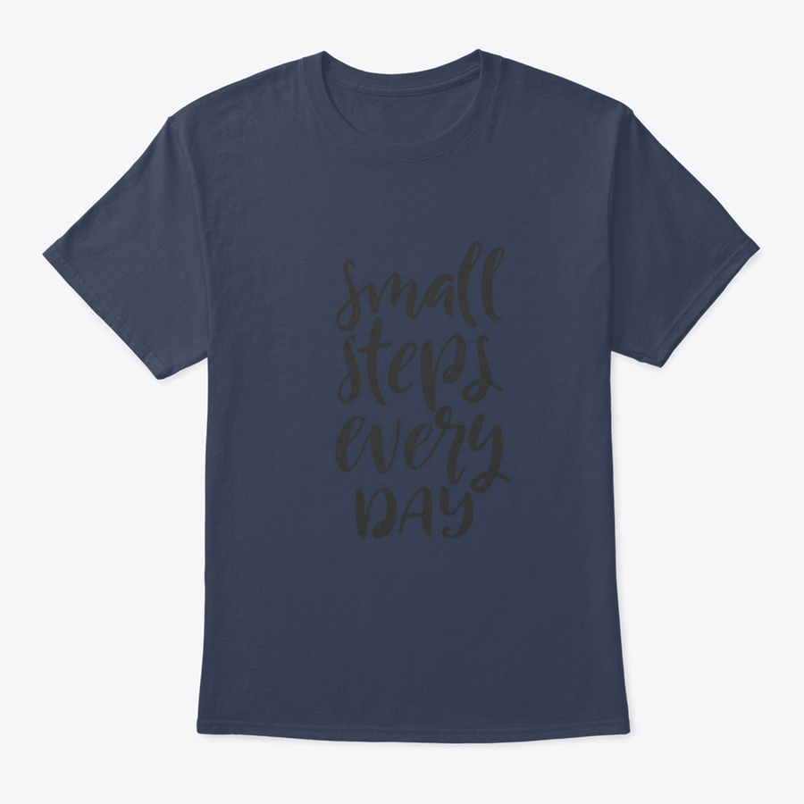 A stylish t-shirt featuring hand-drawn brush pen lettering with the phrase 'Small Steps Every', showcasing its comfortable fit and quality fabric.