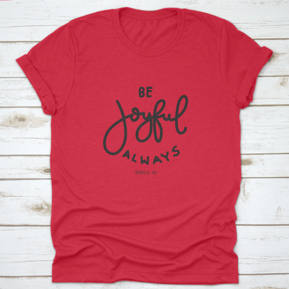 Hand Lettering Be Joyful Always T-shirt on a white background, showcasing modern design and inspirational quote.