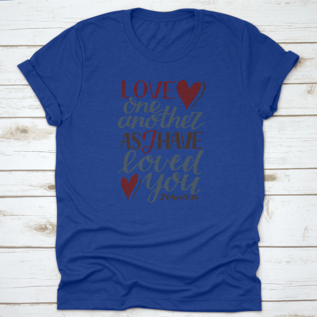 A stylish Hand Lettering Love One Another shirt featuring a modern biblical design, made from soft cotton fabric, perfect for expressing faith and love.