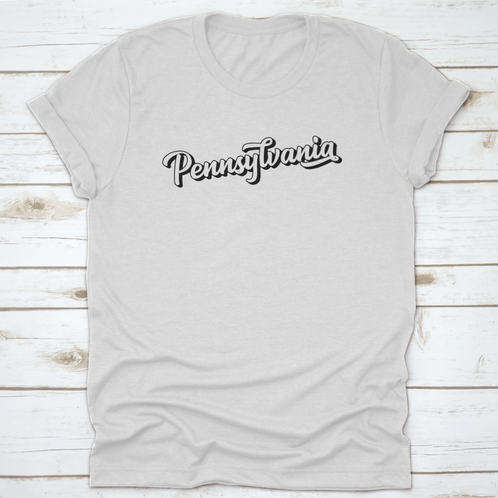 Hand sketched Pennsylvania text design featuring vintage 3D lettering on a soft cotton fabric, showcasing a unique retro style.