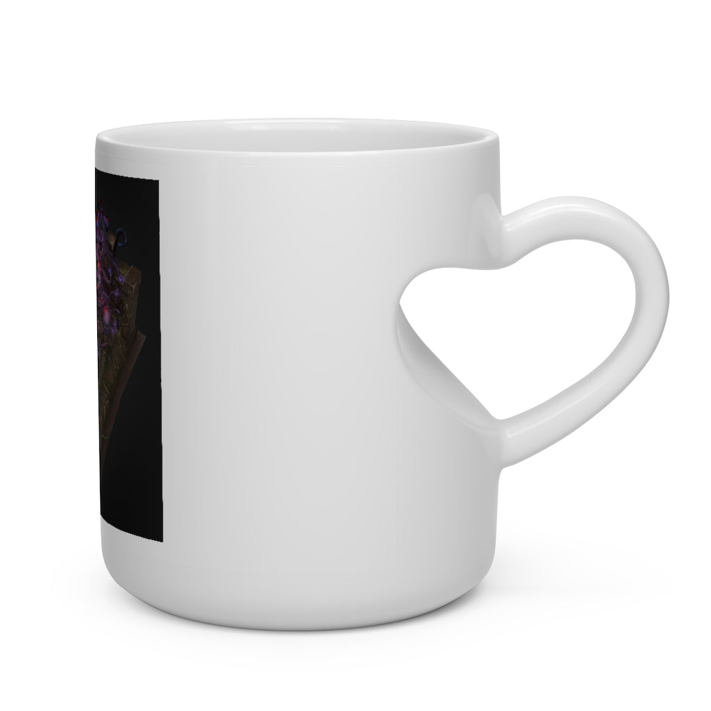 A hand-painted heart-shaped mug with a white ceramic finish and a unique heart-shaped handle, perfect for hot beverages.