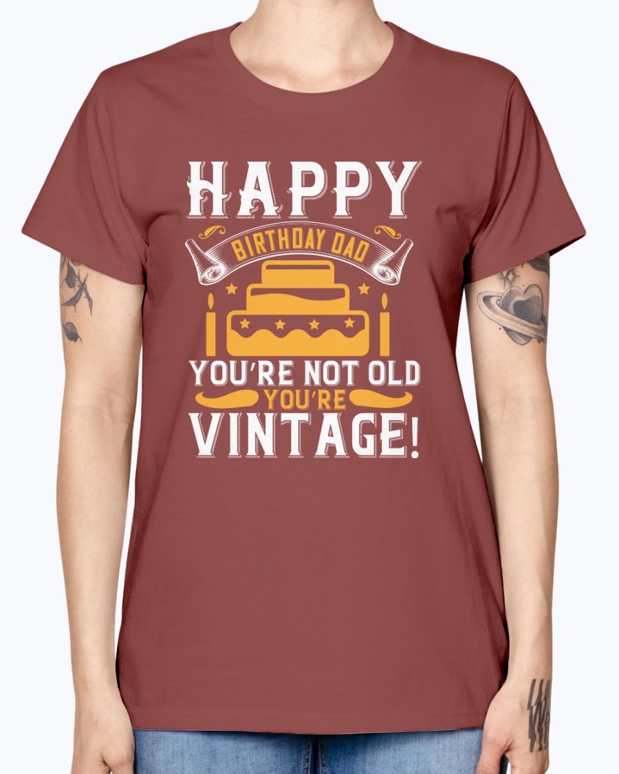 A stylish T-shirt with the phrase 'Happy birthday, Dad! You’re not old, you’re vintage!' printed on it, showcasing a vintage design.