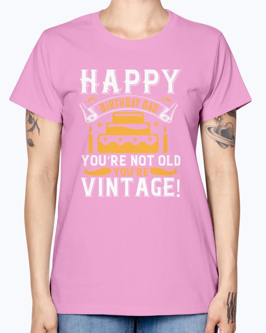 A stylish T-shirt with the phrase 'Happy birthday, Dad! You’re not old, you’re vintage!' printed on it, showcasing a vintage design.