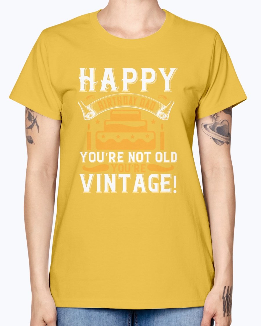 A stylish T-shirt with the phrase 'Happy birthday, Dad! You’re not old, you’re vintage!' printed on it, showcasing a vintage design.
