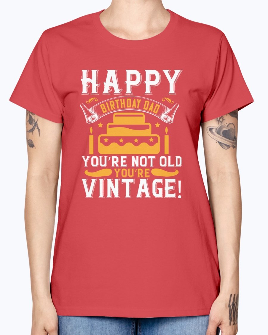 A stylish T-shirt with the phrase 'Happy birthday, Dad! You’re not old, you’re vintage!' printed on it, showcasing a vintage design.
