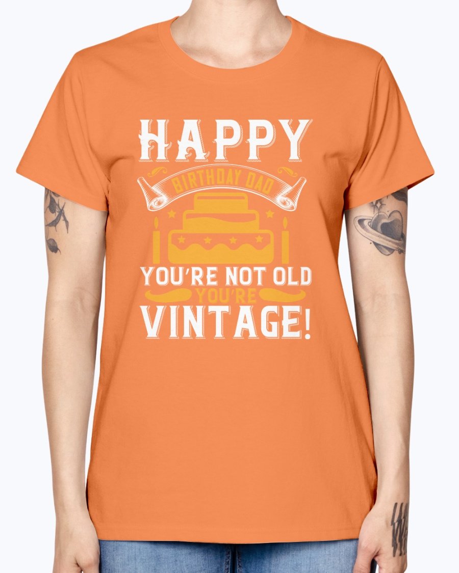 A stylish T-shirt with the phrase 'Happy birthday, Dad! You’re not old, you’re vintage!' printed on it, showcasing a vintage design.