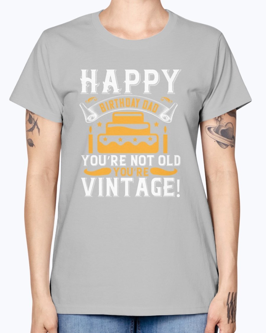 A stylish T-shirt with the phrase 'Happy birthday, Dad! You’re not old, you’re vintage!' printed on it, showcasing a vintage design.