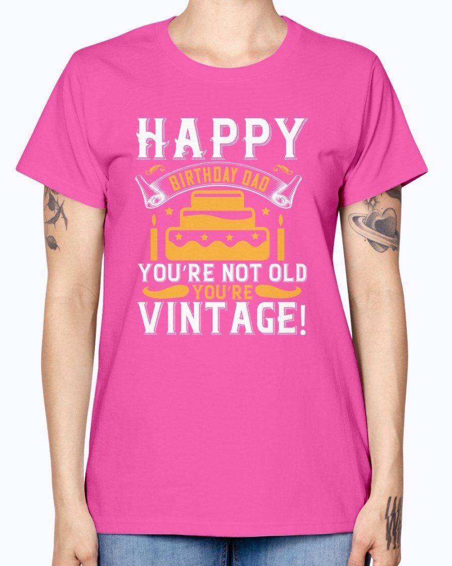 A stylish T-shirt with the phrase 'Happy birthday, Dad! You’re not old, you’re vintage!' printed on it, showcasing a vintage design.