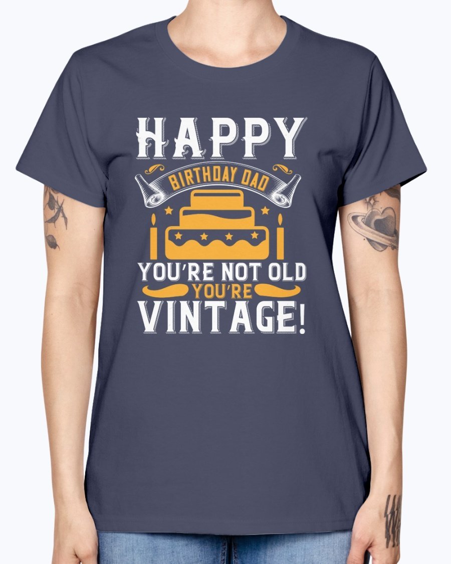 A stylish T-shirt with the phrase 'Happy birthday, Dad! You’re not old, you’re vintage!' printed on it, showcasing a vintage design.