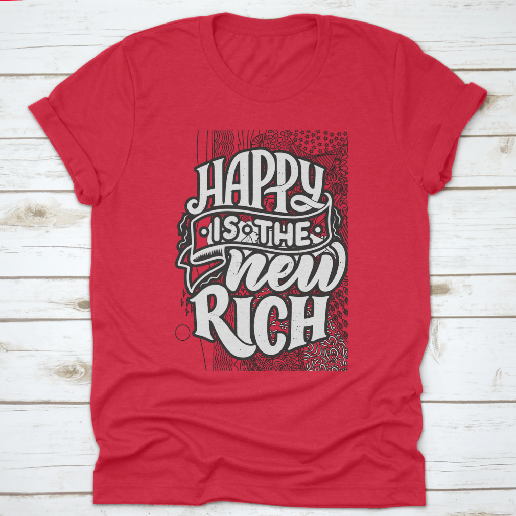 A soft cotton t-shirt featuring the inspirational phrase 'Happy Is The New Rich' in a stylish design, perfect for casual wear.