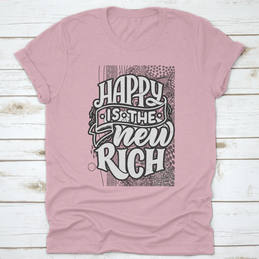 A soft cotton t-shirt featuring the inspirational phrase 'Happy Is The New Rich' in a stylish design, perfect for casual wear.