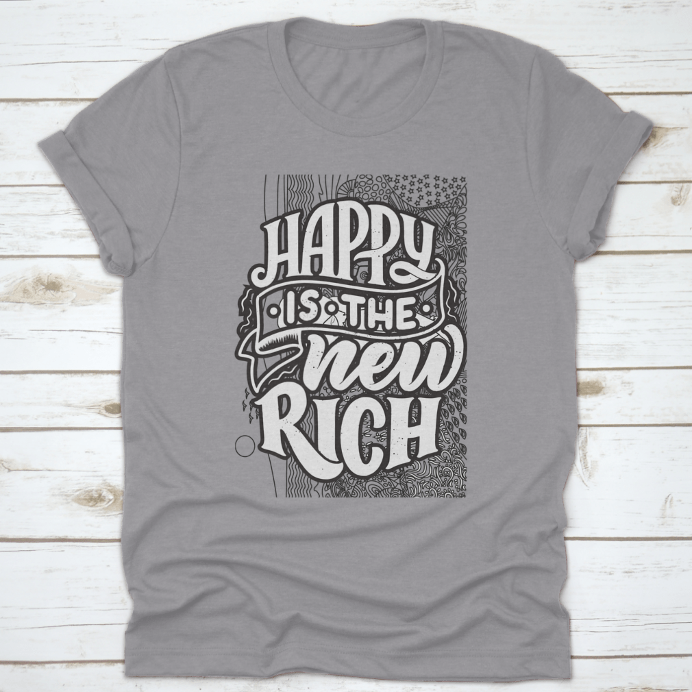 A soft cotton t-shirt featuring the inspirational phrase 'Happy Is The New Rich' in a stylish design, perfect for casual wear.