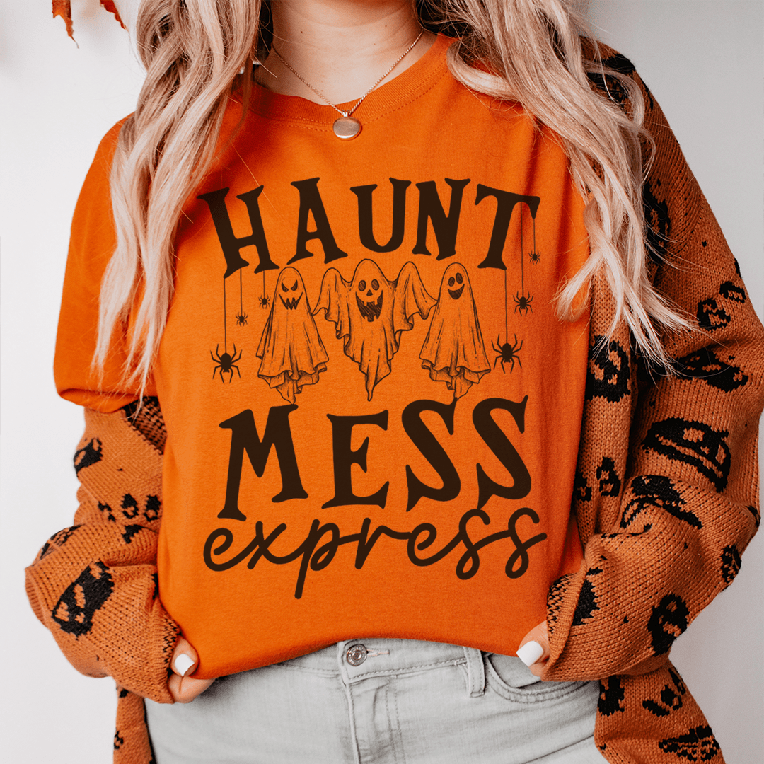 Haunt Mess Express Tee featuring a vibrant Halloween design on soft cotton fabric, perfect for celebrating the spooky season.