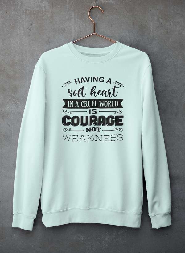 A cozy sweatshirt featuring the phrase 'Having A Soft Heart In A Cruel World', designed by top artists, showcasing a unique and stylish design.