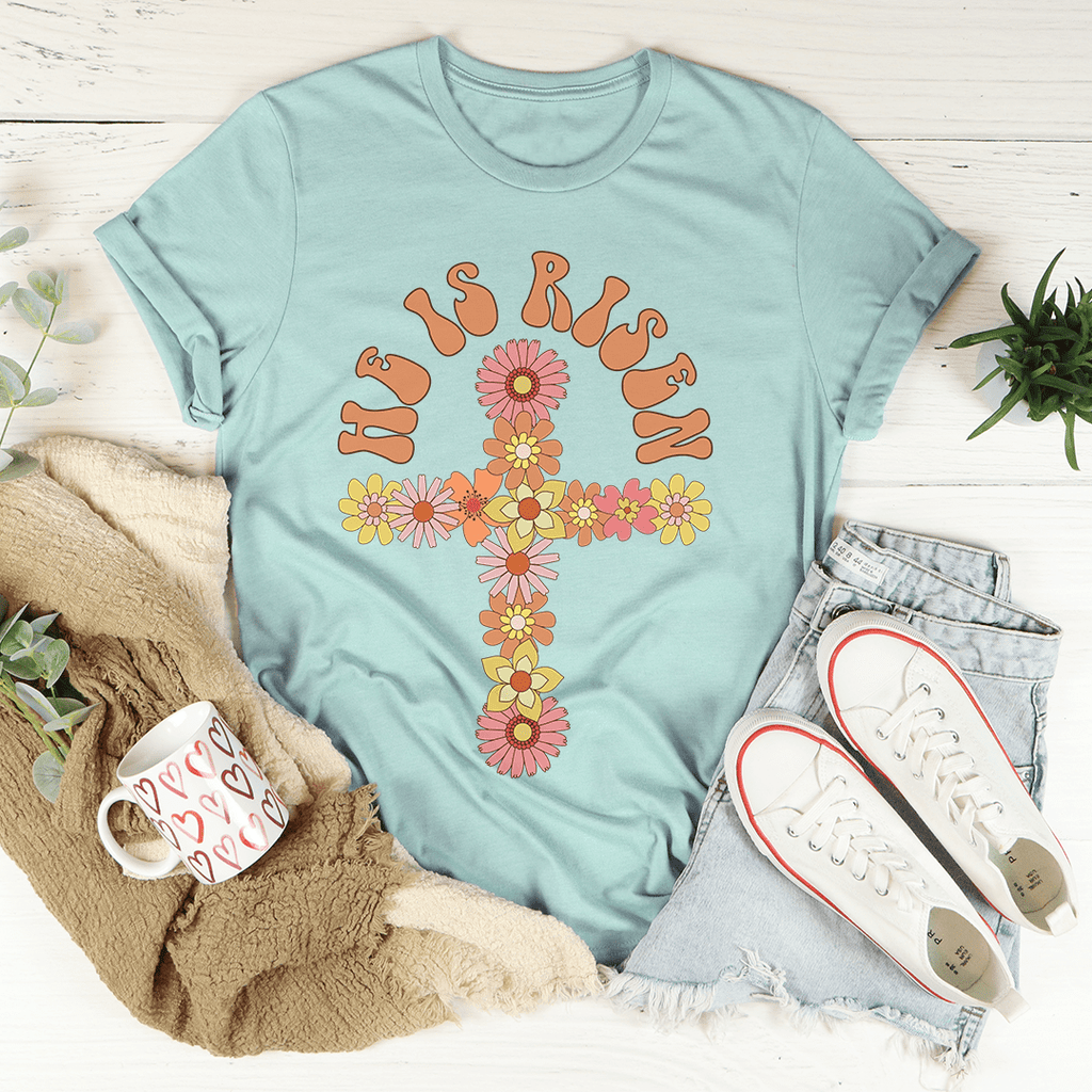 He Is Risen Floral Cross T-Shirt featuring a floral cross design on a soft cotton fabric, perfect for casual wear.