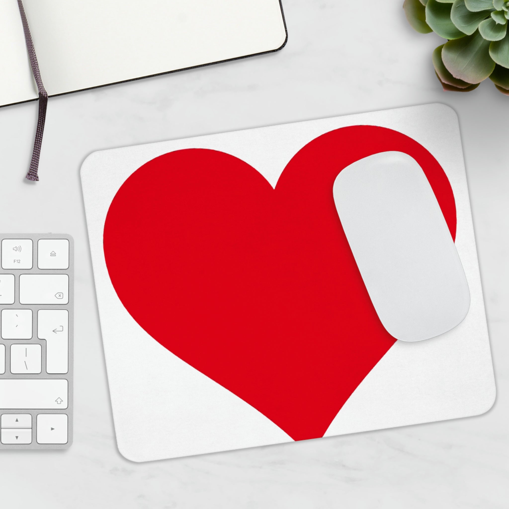 A stylish hearts design mouse pad with a non-slip rubber base, perfect for enhancing any workspace.
