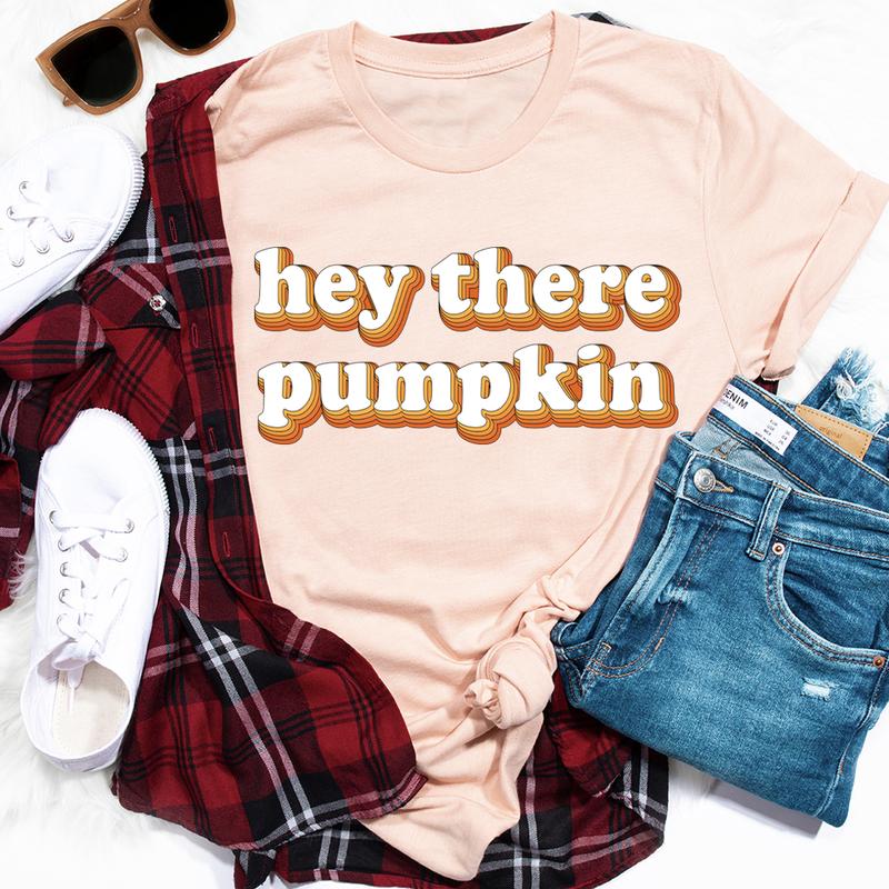 Hey There Pumpkin T-Shirt featuring a playful pumpkin graphic, made of soft ring-spun cotton with durable stitching.