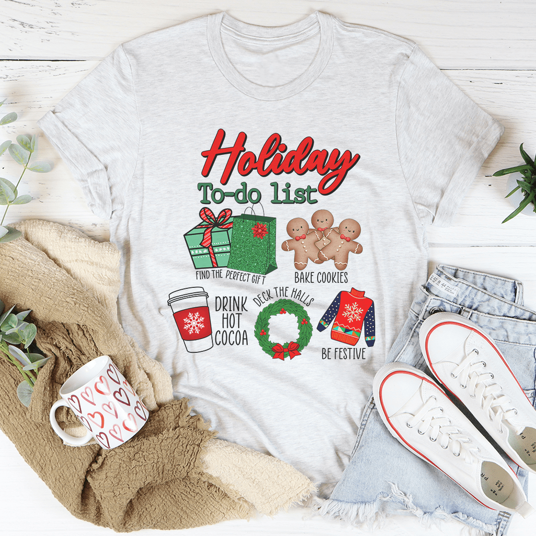 A festive Holiday To Do List tee featuring vibrant Christmas-themed digital print on soft cotton fabric, perfect for holiday celebrations.