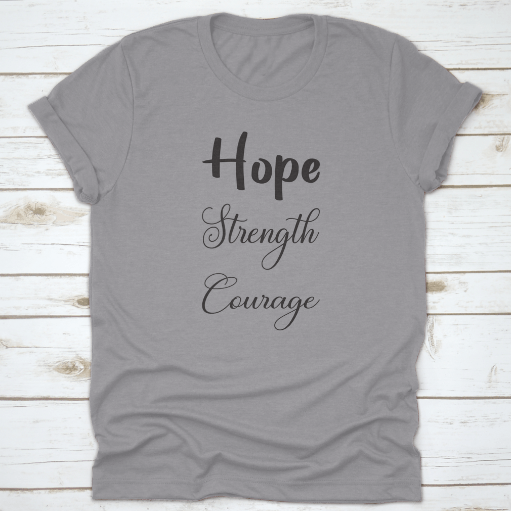 A trendy T-shirt featuring the inspirational quote 'Hope Strength Courage' in stylish lettering, made from soft cotton fabric.