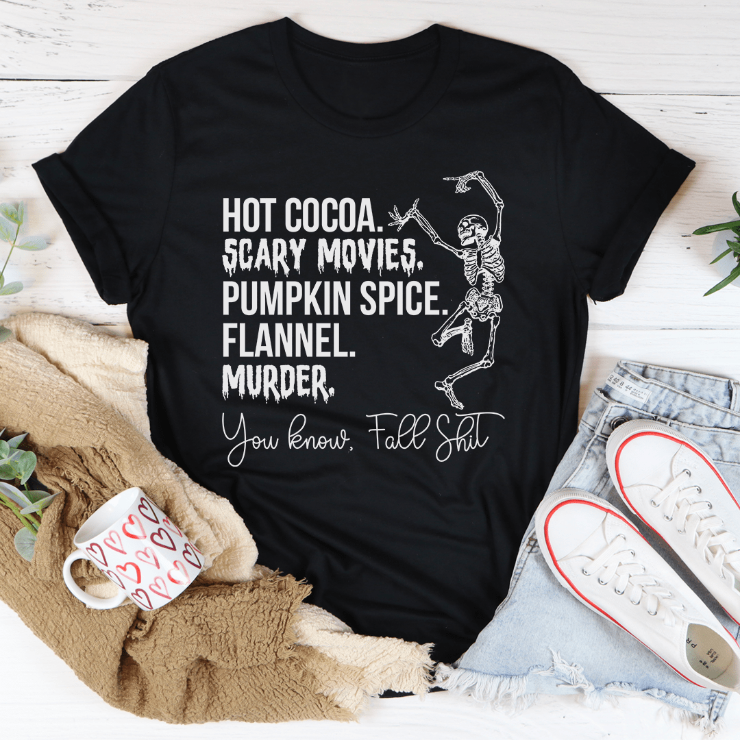 A cozy t-shirt featuring a fun design of hot cocoa, scary movies, and pumpkin spice, perfect for fall.