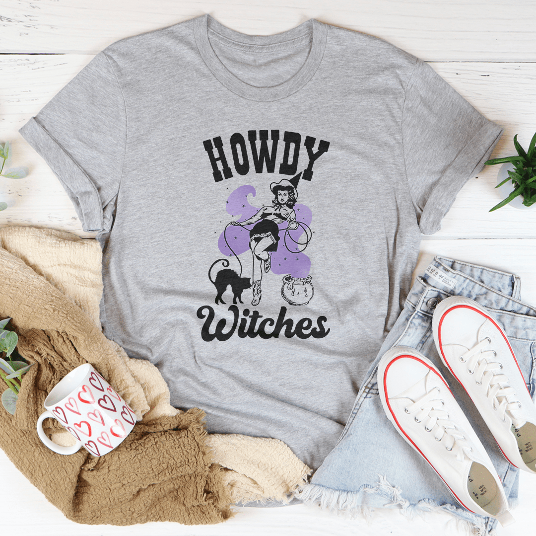 A stylish Howdy Witches Tee featuring vibrant Halloween-themed graphics, made from 100% soft cotton for comfort.