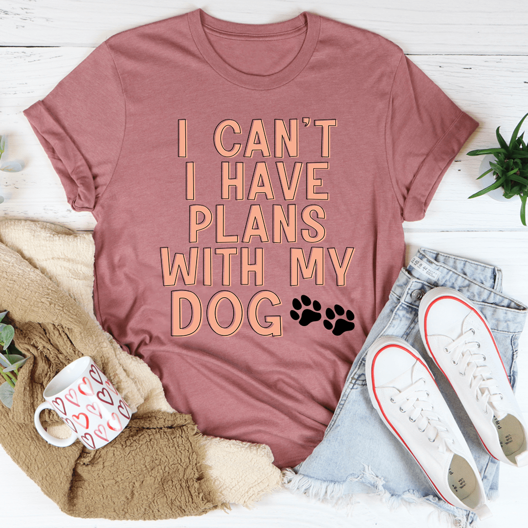 A comfortable and stylish 'I Can't I Have Plans With My Dog' T-Shirt made from soft cotton, featuring a playful slogan for dog lovers.