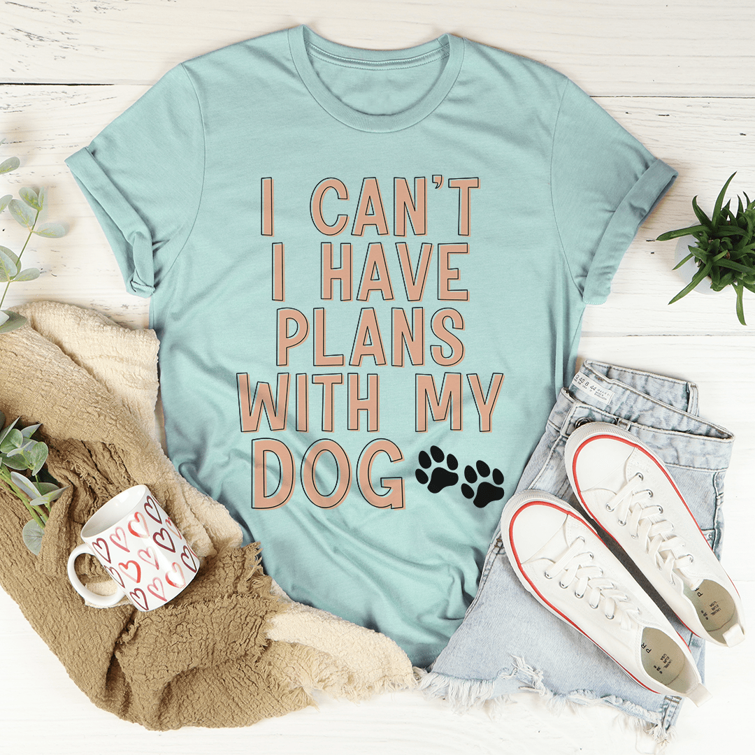 A comfortable and stylish 'I Can't I Have Plans With My Dog' T-Shirt made from soft cotton, featuring a playful slogan for dog lovers.