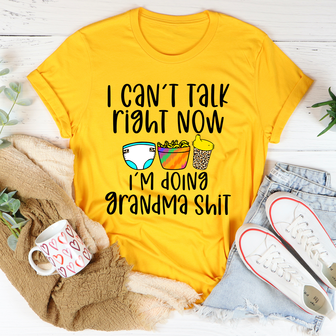 A comfortable and stylish t-shirt featuring the phrase 'I Can't Talk Right Now I'm Doing Grandma Stuff', made from soft cotton.