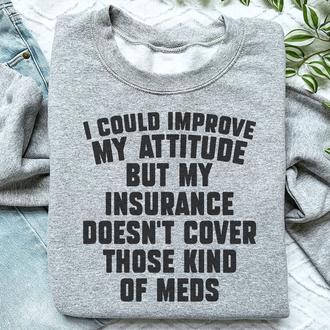 Cozy hoodie featuring the phrase 'I Could Improve My Attitude But My Insurance Doesn't', designed by top artists, made from cotton/poly fleece blend.