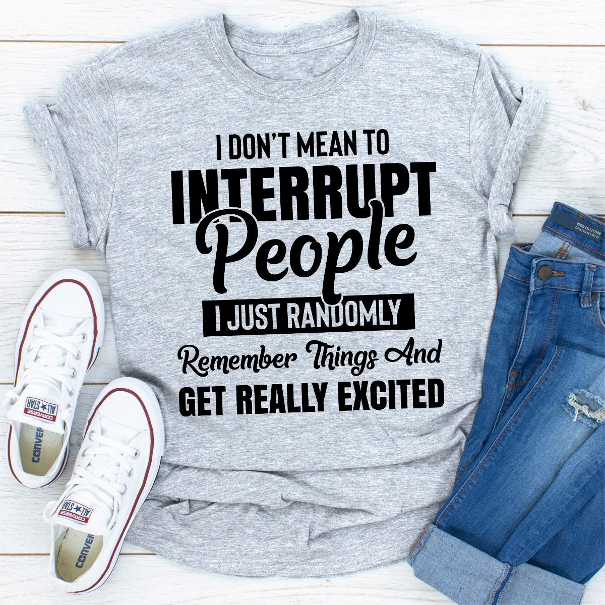 A comfortable and stylish t-shirt featuring the quote 'I Don't Mean to Interrupt People I Just Randomly Remember Things and', made from soft ring-spun cotton.