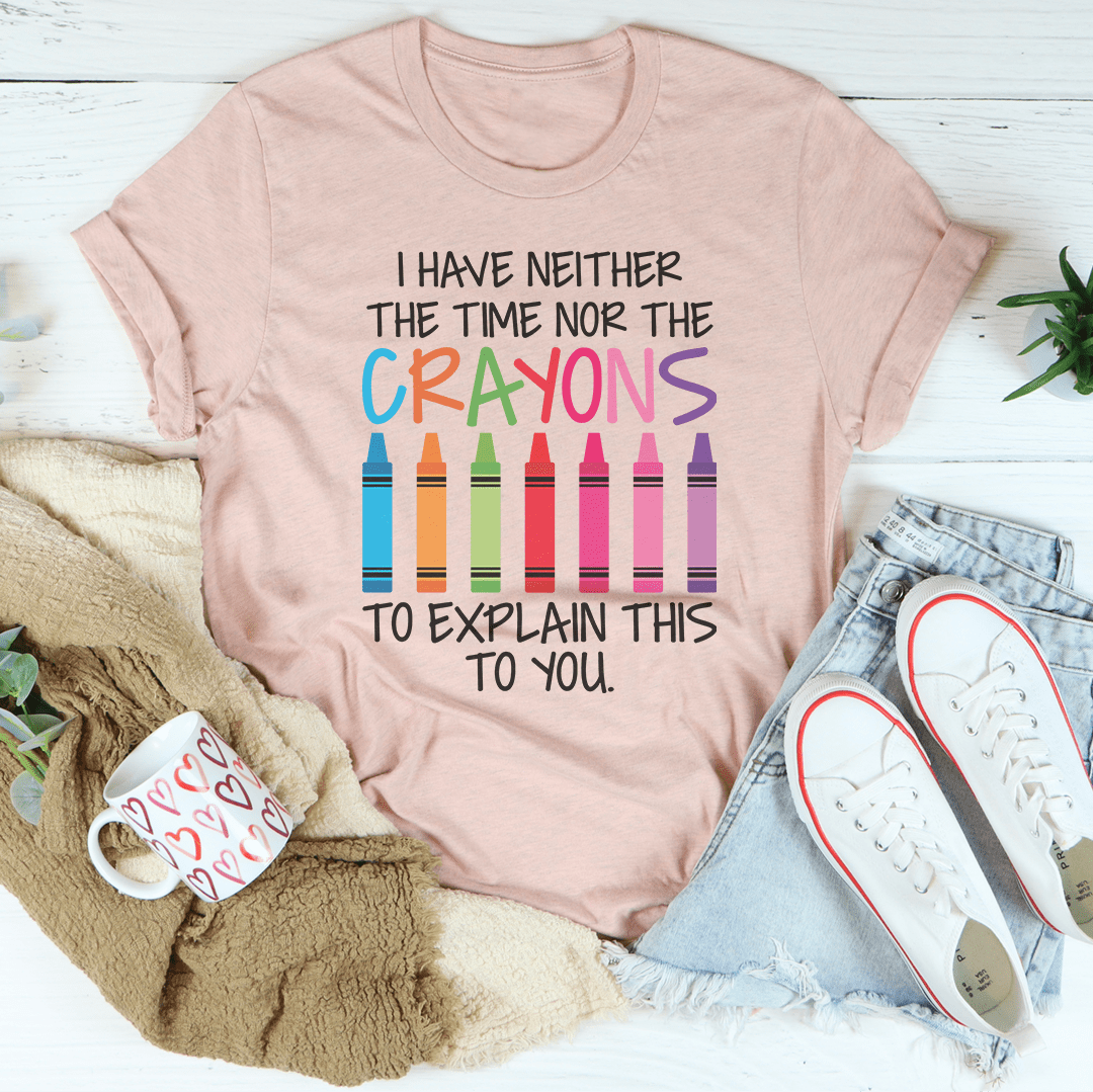 A stylish black t-shirt featuring the phrase 'I Have Neither The Time Nor The Crayons To Explain This To You' printed in bold letters.