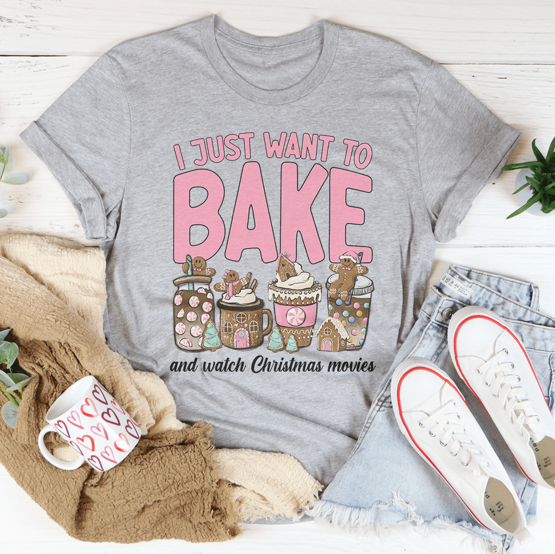 A festive Christmas-themed tee featuring the phrase 'I Just Want To Bake And Watch Christmas Movies', made from soft cotton.
