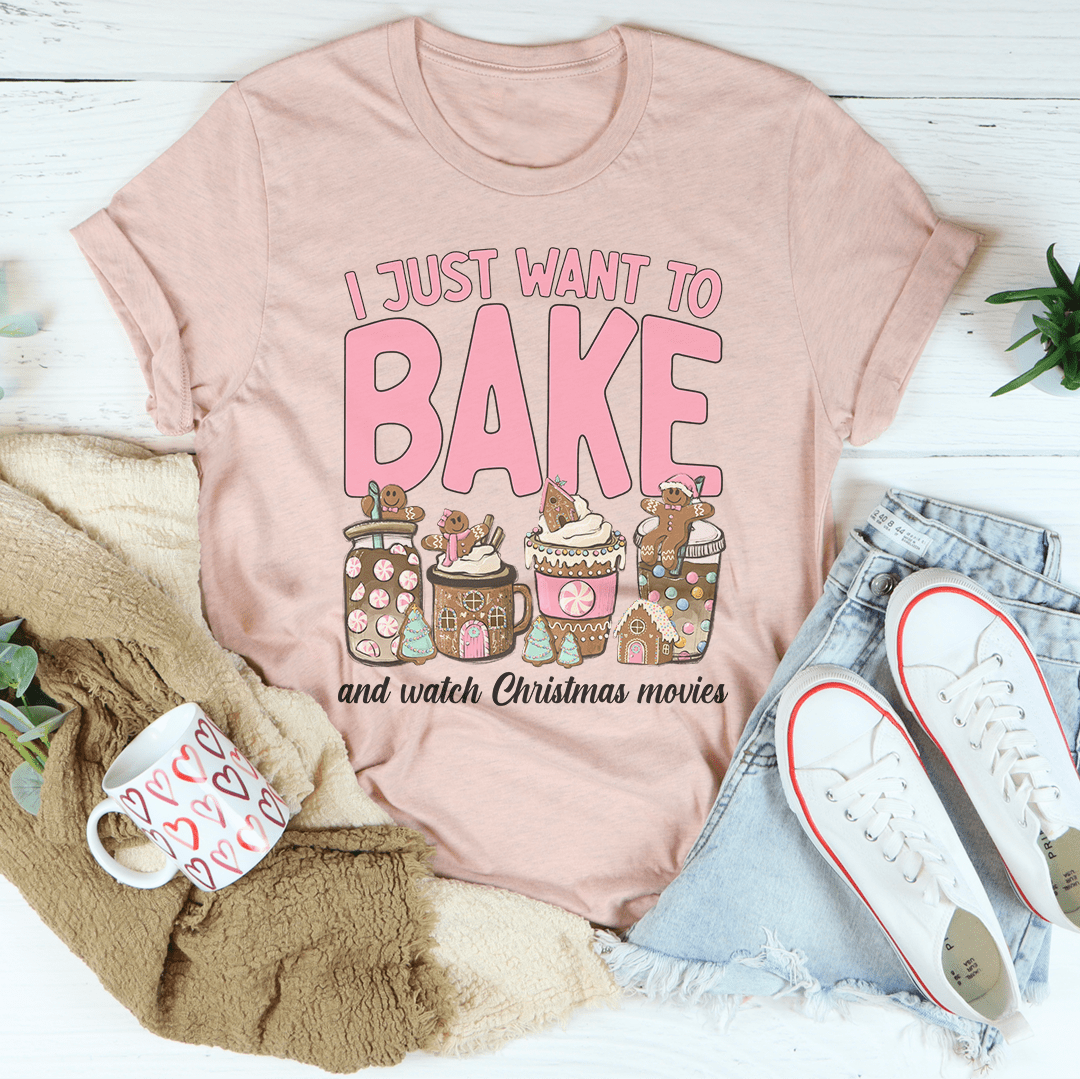 A festive Christmas-themed tee featuring the phrase 'I Just Want To Bake And Watch Christmas Movies', made from soft cotton.