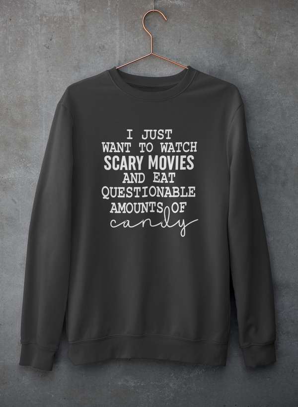 Cozy sweatshirt featuring the phrase 'I Just Want To Watch Scary Movies And Eat Candy', perfect for movie nights.