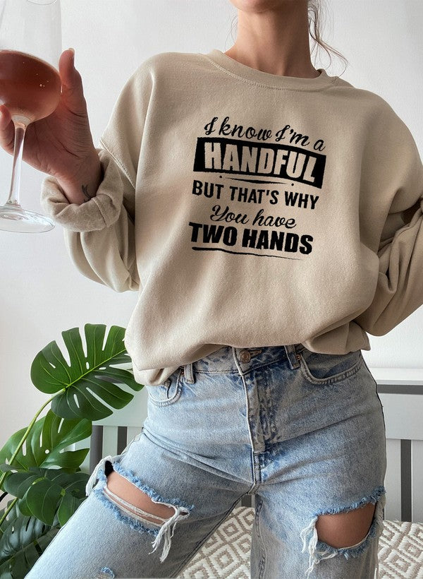 I Know I'm A Handful But That's Why You Have Two Hands Sweat Shirt featuring a playful design on a cozy fleece fabric.