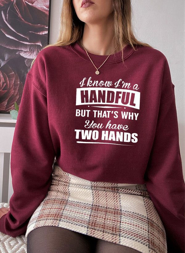 I Know I'm A Handful But That's Why You Have Two Hands Sweat Shirt featuring a playful design on a cozy fleece fabric.