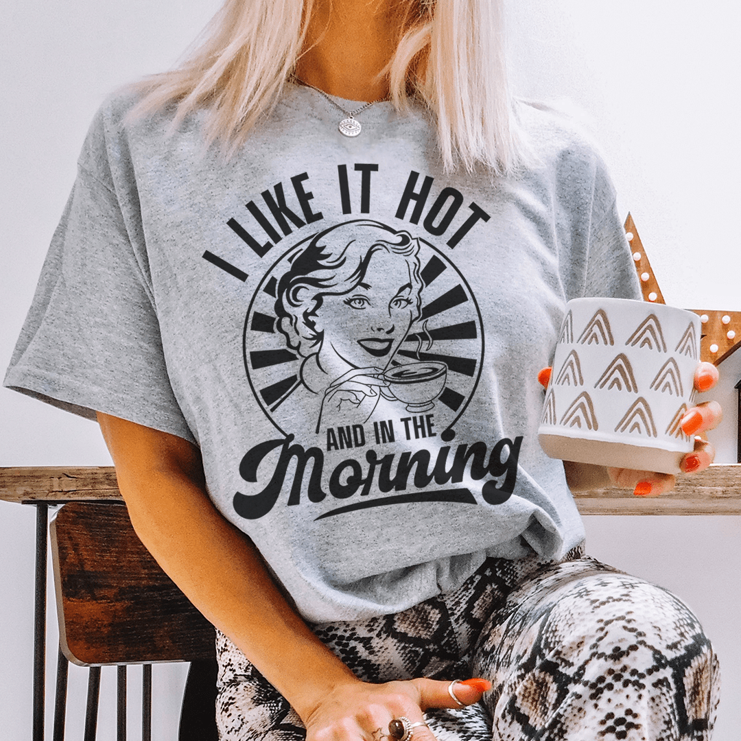 I Like It Hot And In The Morning T-Shirt displayed on a hanger, showcasing its soft cotton fabric and double stitching.