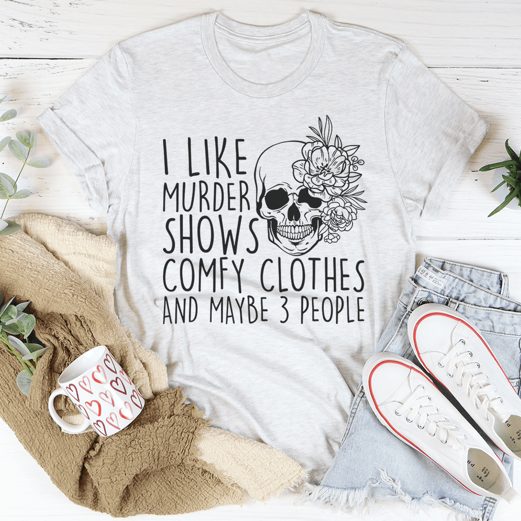 A comfortable t-shirt featuring the phrase 'I Like Murder Shows Comfy Clothes And Maybe 3 People' printed on it, showcasing its soft fabric and durable stitching.