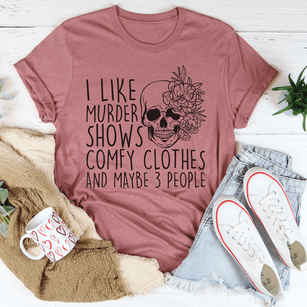 A comfortable t-shirt featuring the phrase 'I Like Murder Shows Comfy Clothes And Maybe 3 People' printed on it, showcasing its soft fabric and durable stitching.