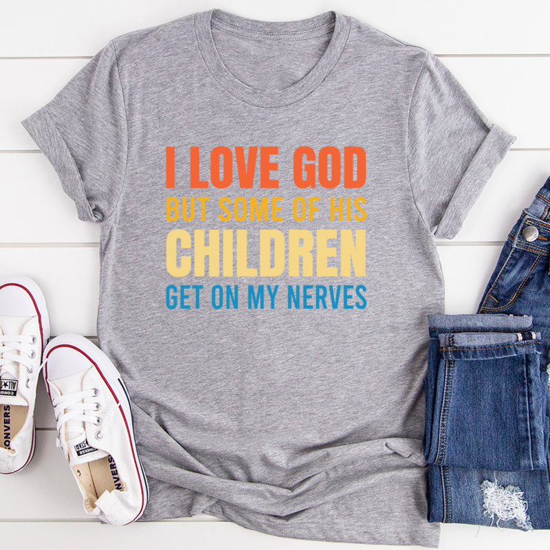 A soft, durable t-shirt featuring the phrase 'I Love God But Some Of His Children' printed on the front, showcasing its comfortable fit and quality fabric.