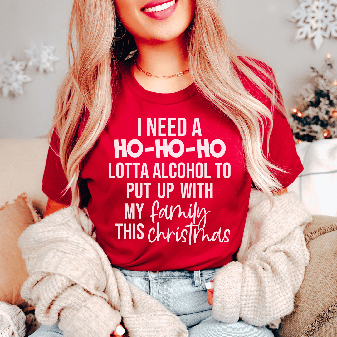 A festive 'I Need A Ho Ho Ho Lotta Alcohol Tee' made from 100% soft cotton, featuring a vibrant holiday-themed design.